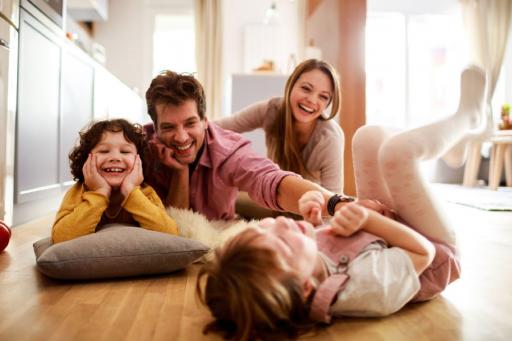  Happy family playing on the floor