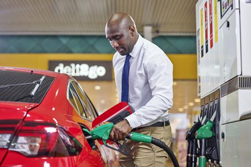 AAA Members Save More at Shell - man filling his car with gas