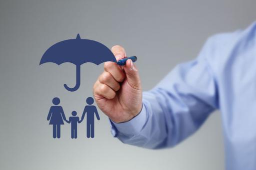 Umbrell insurance - man drawing a blue umbrella on a gray screen